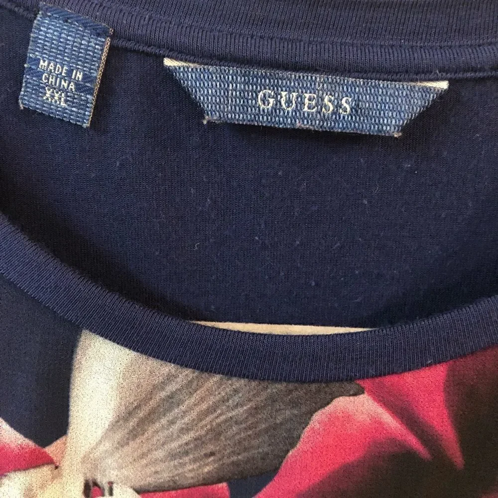 Guess tunic top, small snag line at the top
